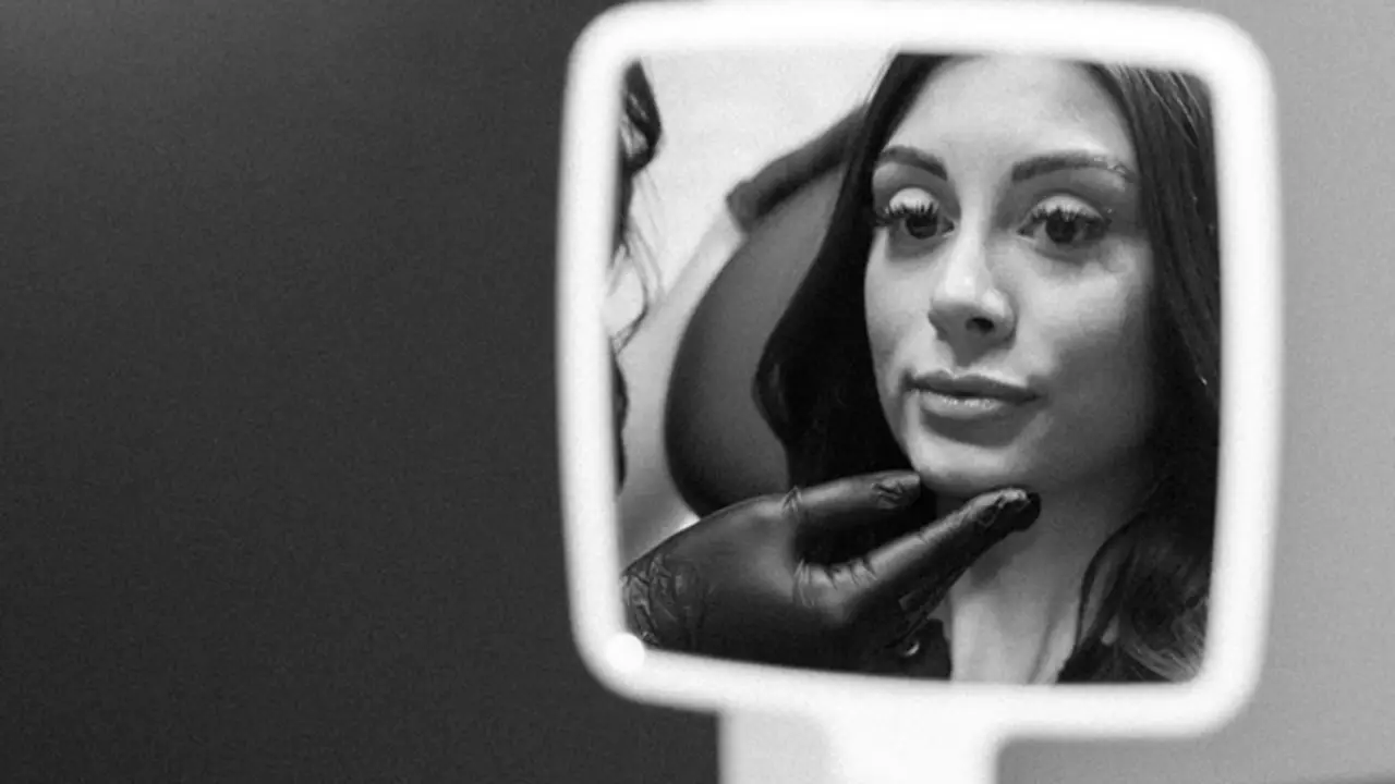 A clinician administering medical-grade hyaluronic acid dermal filler for facial contouring.